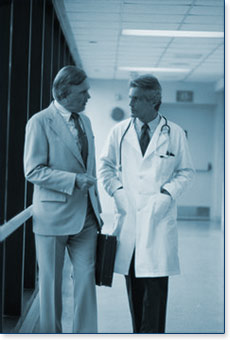doctor talking to corporate person